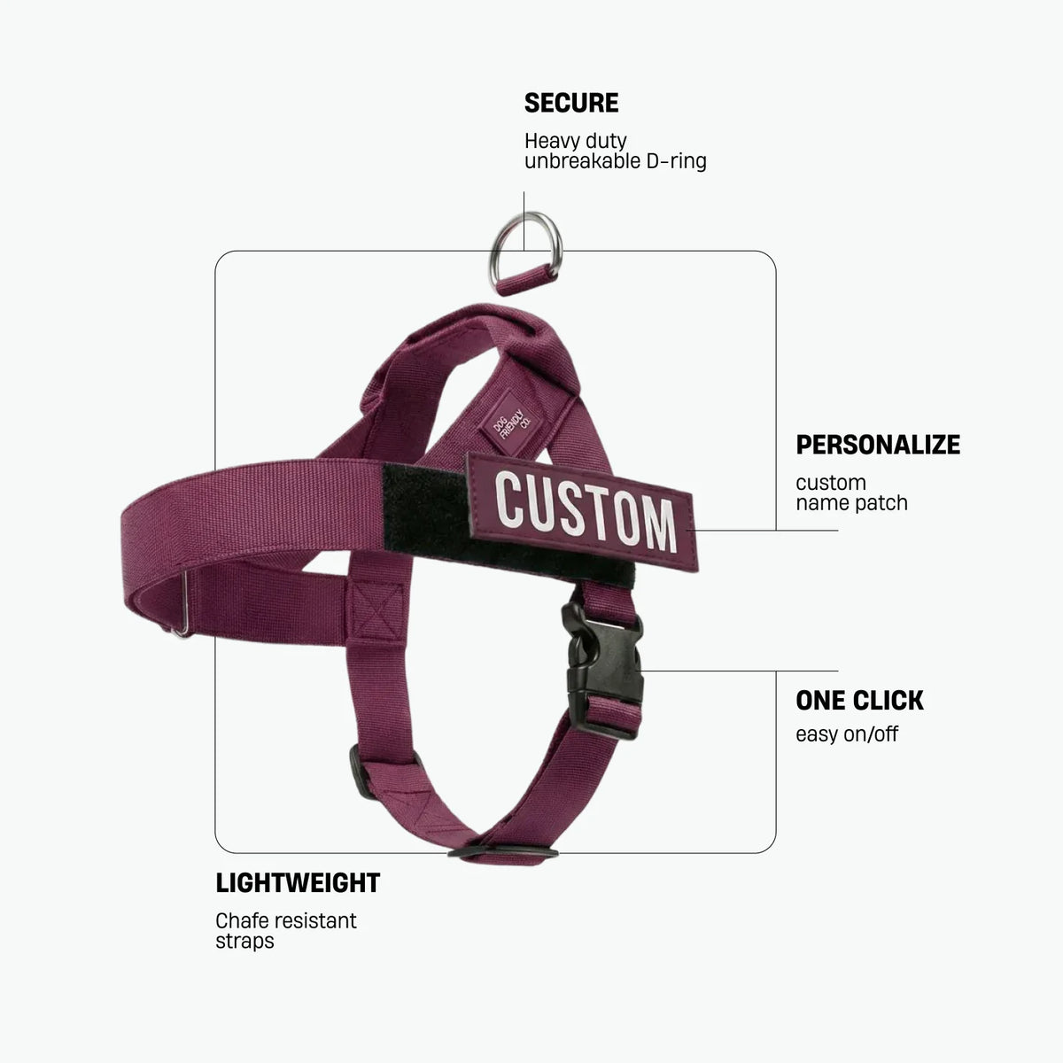 Burgundy dog harness with labels identifying the heavy-duty back D-ring, lightweight chafe-resistant straps, and one-click buckle.
